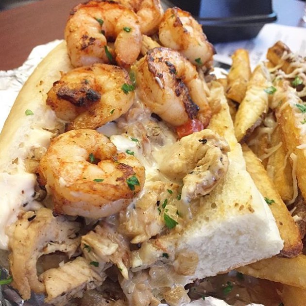The OMG Philly (Grilled Chicken and Jumbo Shrimp with Sautéed Mushrooms, Onions, Peppers, Swiss Cheese on a Brioche Roll with Yum Yum Mayo) served with Garlic Parmesan Fries! The @FoodChasers do it again!! 🔥💣🔑