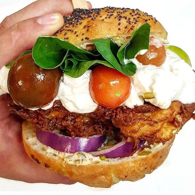 Buttermilk and Herb crusted chicken, fresh burrata, cherry pepper relish, watercress and heirloom tomatoes on a fresh baked bun! And just like that @ChefMarcMarrone does it again!! 🏆💣