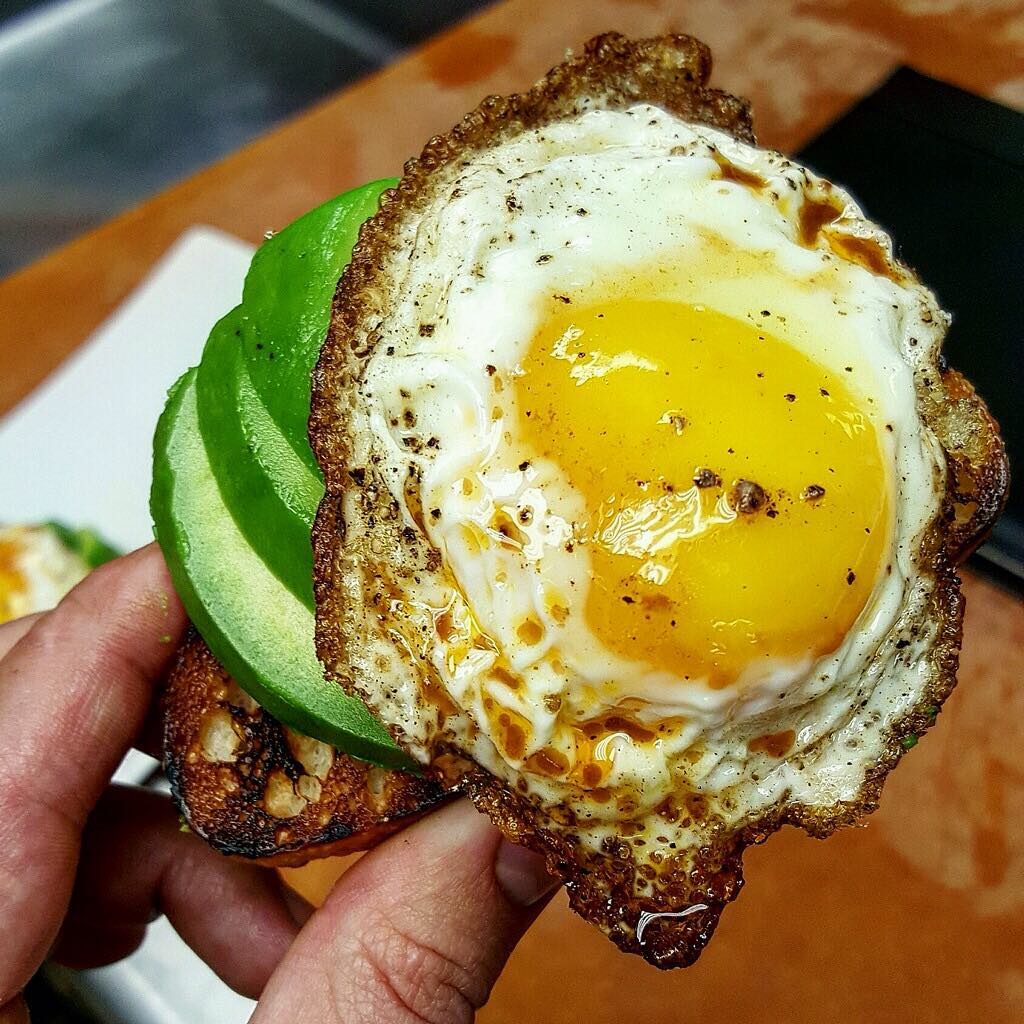 Fried egg in merquez sausage fat, avocado on grilled toast perfected by @chefmarcmarrone!! The @taobeach menu is looking pretty 💣 these days!!