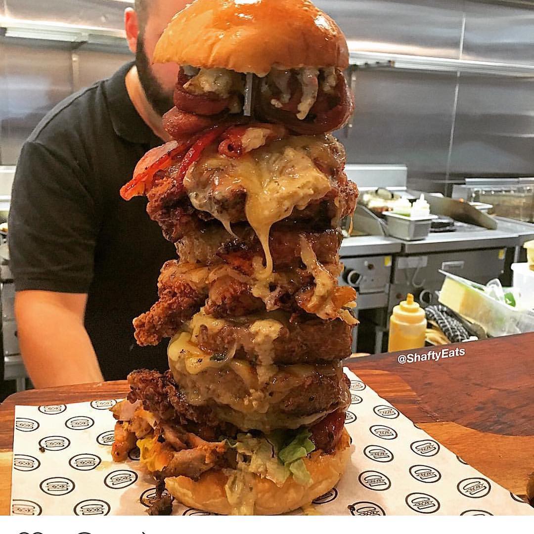 😳😳 Behold the “F*** me up burger” via @shaftyeats at @_meatinthemiddle_ 🙃
4 x beef patties 
4 x fried chicken 
Chicken Souvlaki Meat
8 x cheese 
2 x Jalapeno poppers
Pineapple 
Lettuce
Ouzo Aioli