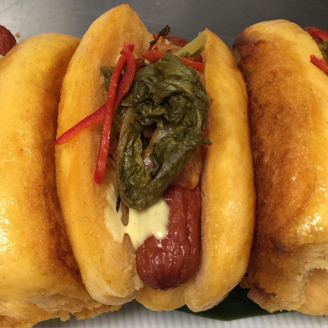 @ChefMarcMarrone made us these Wagyu beef hotdogs with pickled mustard green, Kimchi relish in a house made sweet potato Bao bun!! Without a doubt Approved!!😍🔑💣