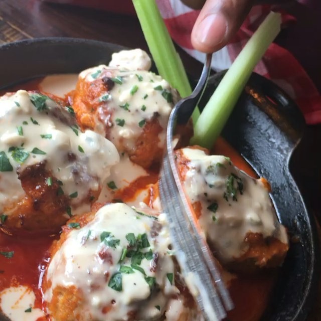 These Buffalo chicken meat balls from @forkandballs are incredible! Tender & juicy chicken meat balls topped with buffalo sauce and blue cheese that send your mouth into a frenzy! Chicken wings may have a competitor