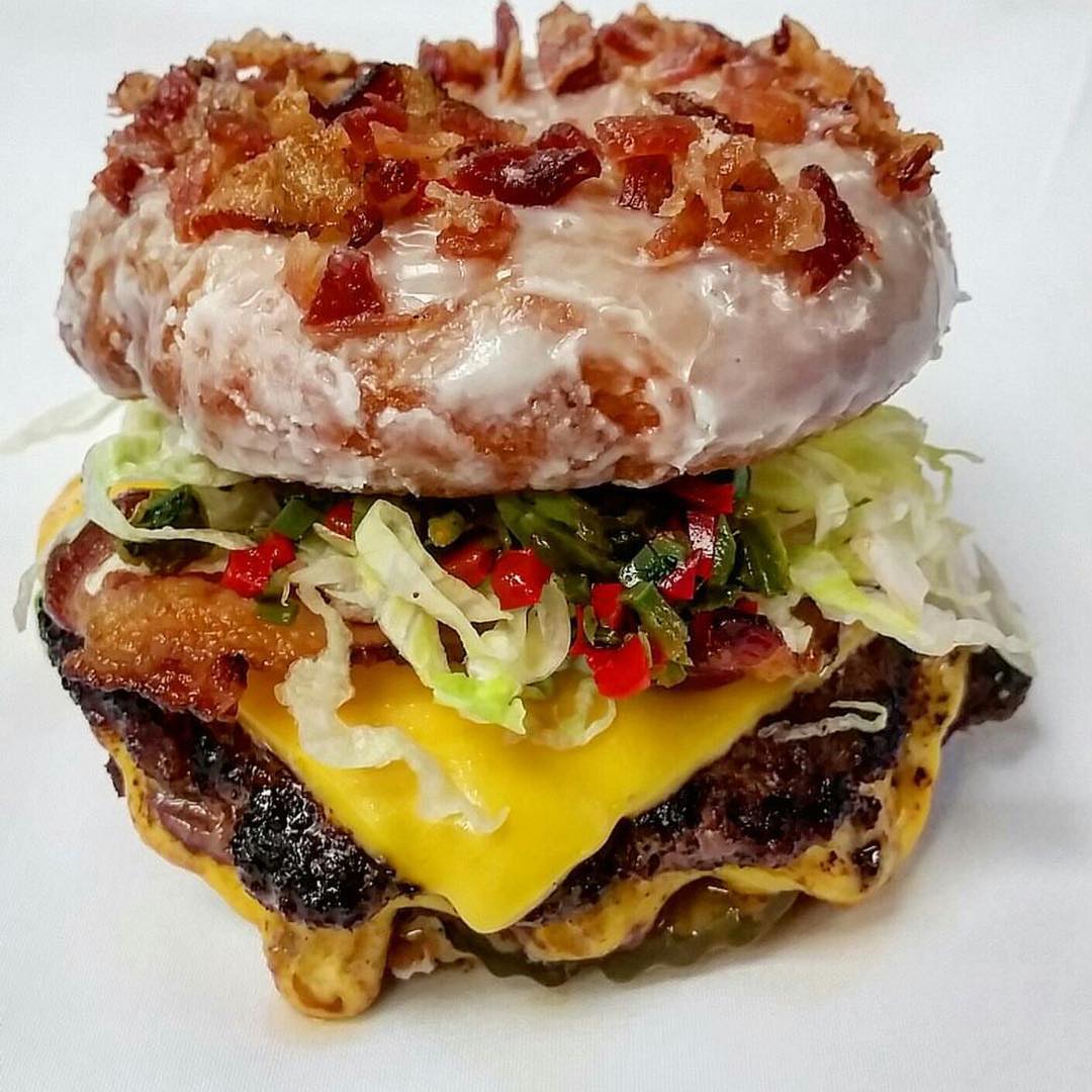 Rootbeer Bacon Glazed Donut Burger 😳😍🍩🍔 with Cheese, Pickled Chilis, Lettuce, Pickles and Chili Mayo!! Hey @ChefMarcMarrone you had us at Bacon, It’s ok to Drool Y’all!!