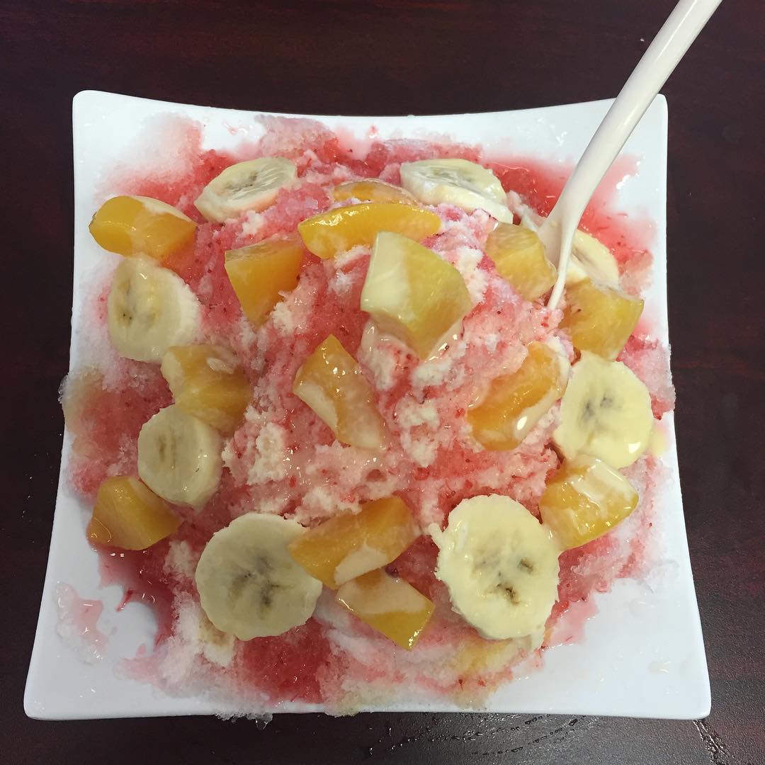 Taiwan shaved ice! Strawberry flavored ice with peaches and bananas covered in condensed Milan Milk Approved by the!!