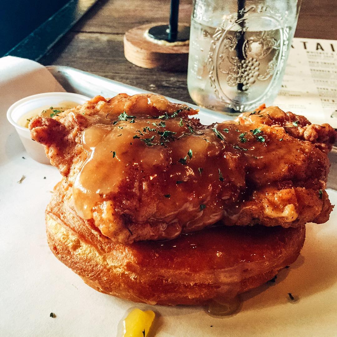 The Mother Clucker at @gourdoughspublichouse in Austin, TX is a MUST TRY. Hand battered fried chicken on a giant fresh made doughnut topped with honey butter. Somebody go check on @thomaswilson2 and make sure he’s not in a food coma 😳 #🐓 #🍩